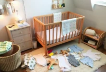 A cozy nursery scene filled with budget-friendly baby supplies, including cloth diapers, a simple wooden crib, handmade toys, and organic baby clothes arranged neatly on a soft rug, warm lighting creating a welcoming atmosphere.